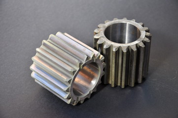 metal cogs cogwheels on a dark background.