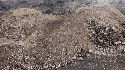 Large piles of old asphalt in the after road repair.