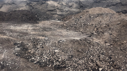 Large piles of old asphalt in the after road repair.