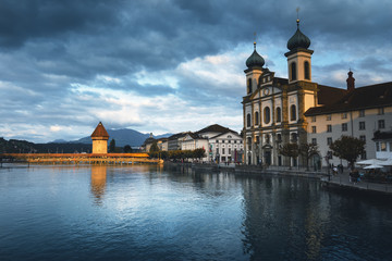 Fototapeta na wymiar bridge Kapellbrucke, Wasserturm Tower and the Church of the Jesuits, Lucerne, Switzerland