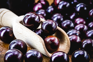 Brazilian fruit called jaboticaba or jabuticaba, is the native grape of Brazil. Plinia cauliflora species, on a rustic table, exotic fruit, anti-inflammatory.