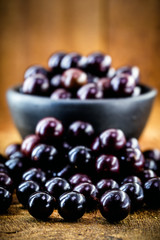 Brazilian fruit called jaboticaba or jabuticaba, is the native grape of Brazil. Plinia cauliflora species, on a rustic table, exotic fruit, anti-inflammatory.