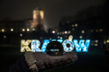 Glowing inscription Kraków in the night, Cracow