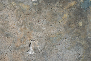 The texture of a cracked concrete wall. Concrete surface with cracks. Old wall. Construction and repair background.