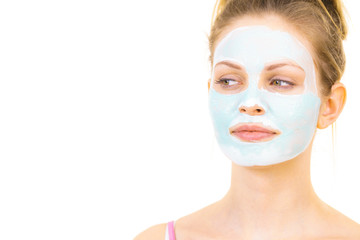 Girl with green mud mask on face