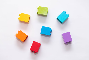 Plastic building blocks isolated on white background.
Blocks of colors of the rainbow.
Early learning. Educational toys