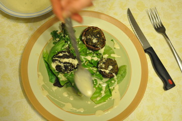 Spreading Dressing on Stuffed Mushrooms