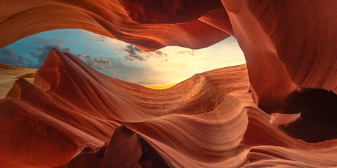 Delightful game of light, color and structure on the gorgeous twisted colorful sandstone waves of the Lower Antelope Canyon in Page city Arizona, USA. Travel and fine art concept.