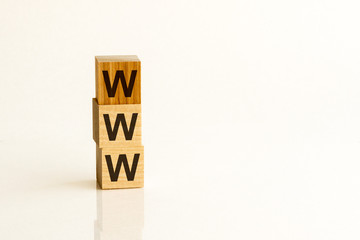 WWW text on wooden cubes on white background