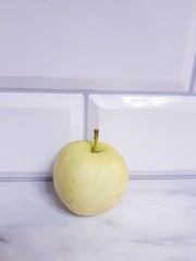 Light green apple on white background