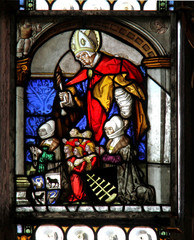Fototapeta na wymiar vetrata dipinta tardogotica (Sant'Erasmo e committenti) nella chiesa parrocchiale di Tesimo (Bolzano)l