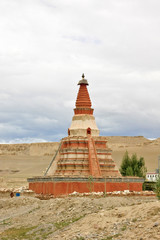 Stupa near Tholing Monastery on the background of Sutlej Valley sand landscape