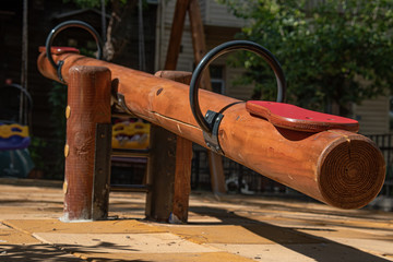 wooden seesaw for children in the park. close-up.