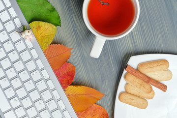 Top view concept autumn with tea and dry leaves and copy space