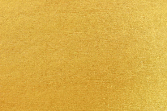 Shiny yellow leaf gold foil texture background