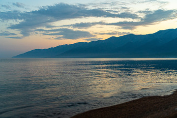 Fototapeta na wymiar Scenic baikal lake in summer, pastel blue dawn