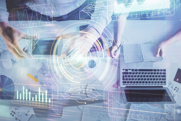Double exposure of man and woman working together and data theme hologram drawing. Computer background. Top View.