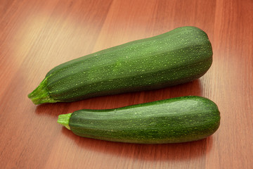 Green zucchini on a wooden board. High quality photo