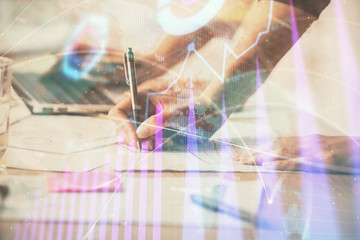 Multi exposure of woman hands typing on computer and financial chart hologram drawing. Stock market analysis concept.