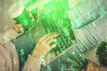 Double exposure of woman hands typing on computer and forex chart hologram drawing. Stock market...