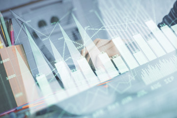 Double exposure of woman hands typing on computer and forex chart hologram drawing. Stock market invest concept.