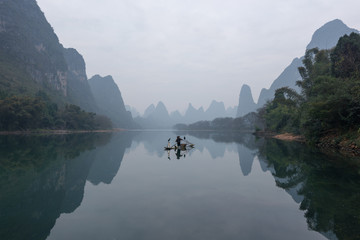 Chinese traditional fisherman with cormorants fishing, Li River