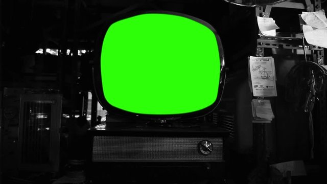 Vintage Round Television with Green Screen. You can replace green screen with the footage or picture you want. You can do it with “Keying” effect in After Effects. Black and White Tone.