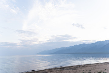 Fototapeta premium Irkutsk region, Olkhon, July 2020: milky sunrise on Baikal Lake, pastel colors, endless sky