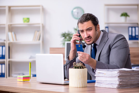 Young male employee working in the office