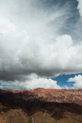 Geology. View of the colorful mountain under a dramatic cloudy sky. Beautiful  rock texture and pattern. 