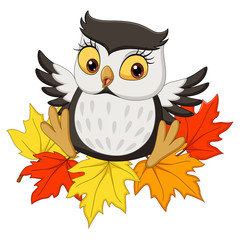 Cute owl cartoon sitting on autumn leaves
