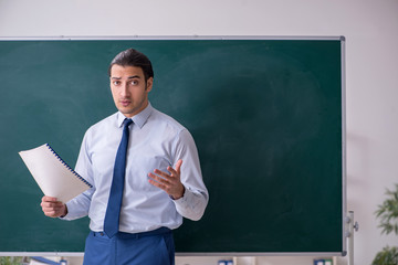 Young man employee in business presentation concept