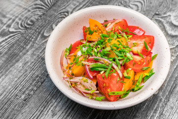 Fresh rustic vegetable salad on rustic background