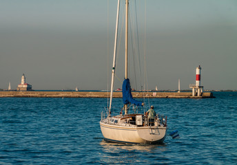 Sailboat Moored in Monroe Harbor With Chicago Harbor Lighthouse, Lake Michigan, Chicago, Illinois,...