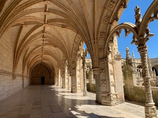 Fototapeta na wymiar Beautiful reticulated vaulting on courtyard or cloisters of Hieronymites Monastery, Mosteiro dos Jeronimos, famous Lisbon landmark in Belem district and Unesco Heritage, Portugal