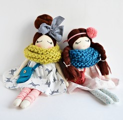 Heirloom textile dolls wearing cute dresses, gaiters and knitted scarfs