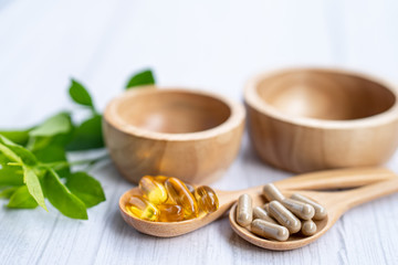 Alternative medicine herbal organic capsule with vitamin E omega 3 fish oil, mineral, drug with herbs leaf natural supplements for healthy good life.