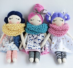 Heirloom textile dolls wearing cute dresses, gaiters and knitted scarfs