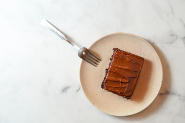 Slice of chocolate cake with chocolate frosting