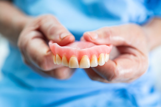 Asian Senior Or Elderly Old Woman Patient Holding To Use Denture In Nursing Hospital Ward, Healthy Strong Medical Concept