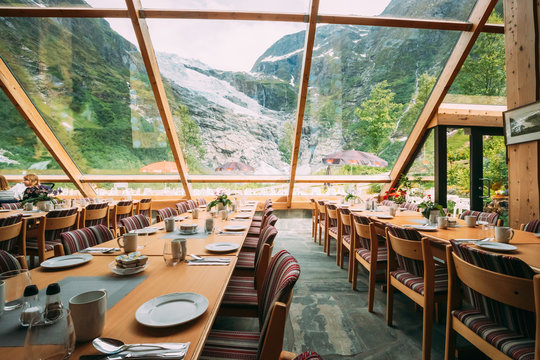 Jostedalsbreen National Park, Norway. Interior Of Cafe With Amazing View To Boyabreen Glacier In Spring Sunny Day. Famous Norwegian Landmark And Popular Destination