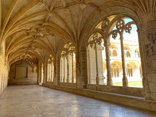 Fototapeta na wymiar Beautiful reticulated vaulting on courtyard or cloisters of Hieronymites Monastery, Mosteiro dos Jeronimos, famous Lisbon landmark in Belem district and Unesco Heritage, Portugal