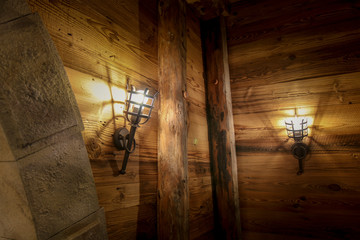 The lamp on the brown wooden in a mine .