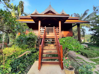 A wooden staircase at outside of traditional house at Thailand