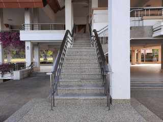 stainless steel handrails are installed on the walls and steps.