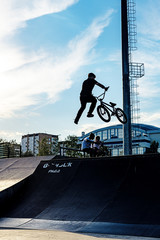 BMX stunt vertical. A professional cyclist Extreme cycling concept. Dert jump. BMX vertical barspin jump. BMX Freestyle Vert Stunt. Halframp. Set Of Skatepark Element