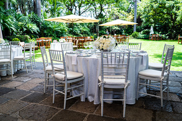 Fototapeta na wymiar Elegant outdoors summer wedding with flowers decoration and mirrors