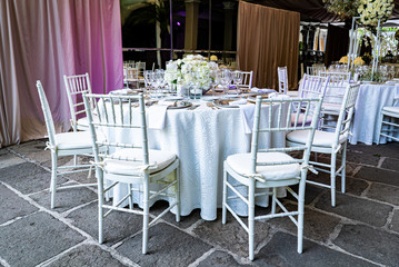 Fototapeta na wymiar Elegant outdoors summer wedding with flowers decoration and mirrors