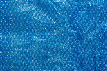 Bubble wrap, blue packaging material texture, and background.