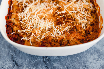 plant-based food, vegan lentil ragu lasagna with dairy-free white sauce and parmesan